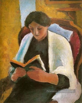 Femme lisant dans le fauteuil rouge Lesende Frauimroten Sessel August Macke Peinture à l'huile